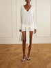 Knotted perforated jersey mini dress